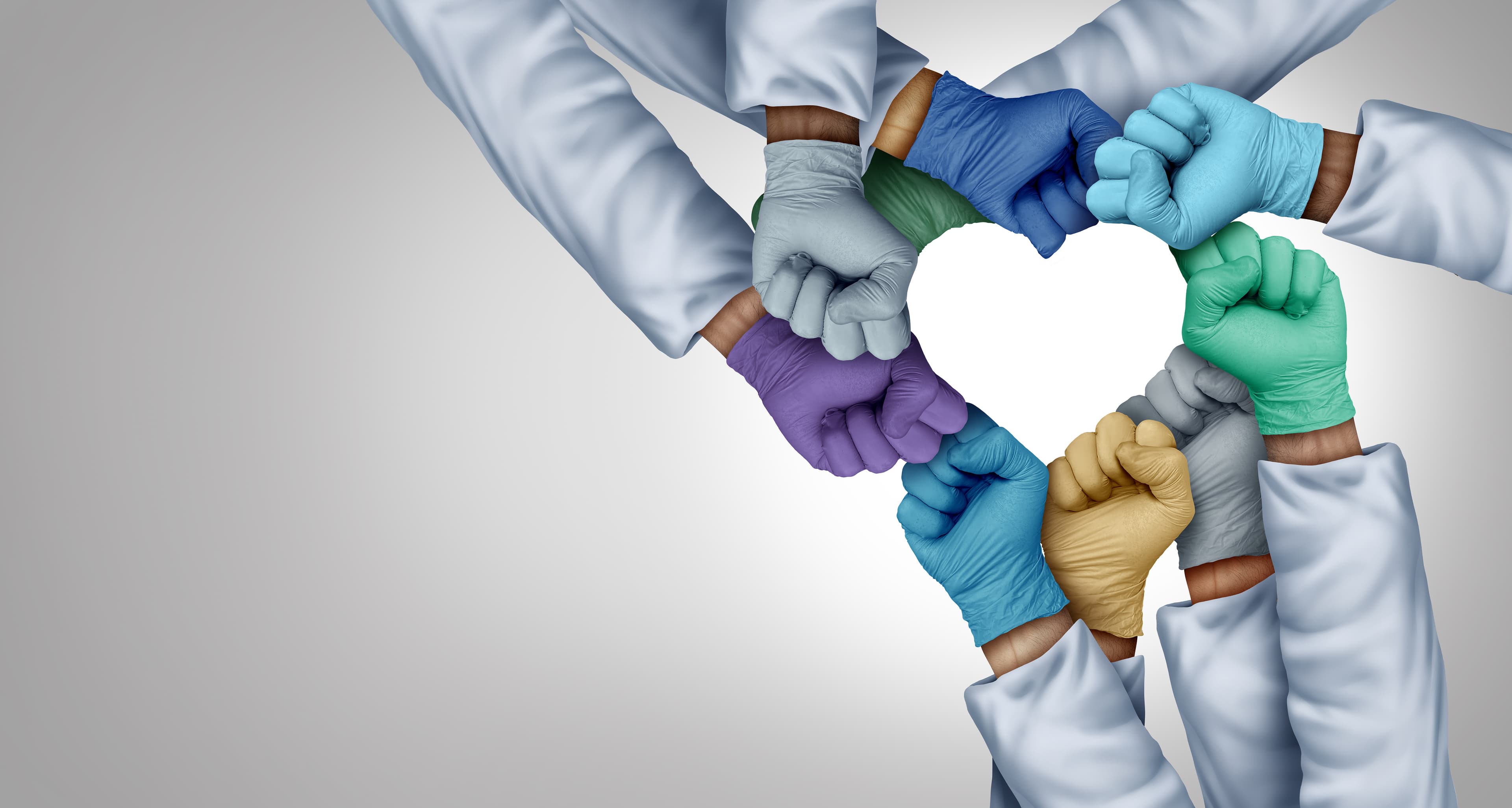 Medical professionals wearing colorful gloves, joining their hands together in a heart shape, symbolizing teamwork, collaboration and unity in healthcare.
